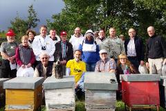 Group of beekeepers visiting a local beekeper in Zafferana